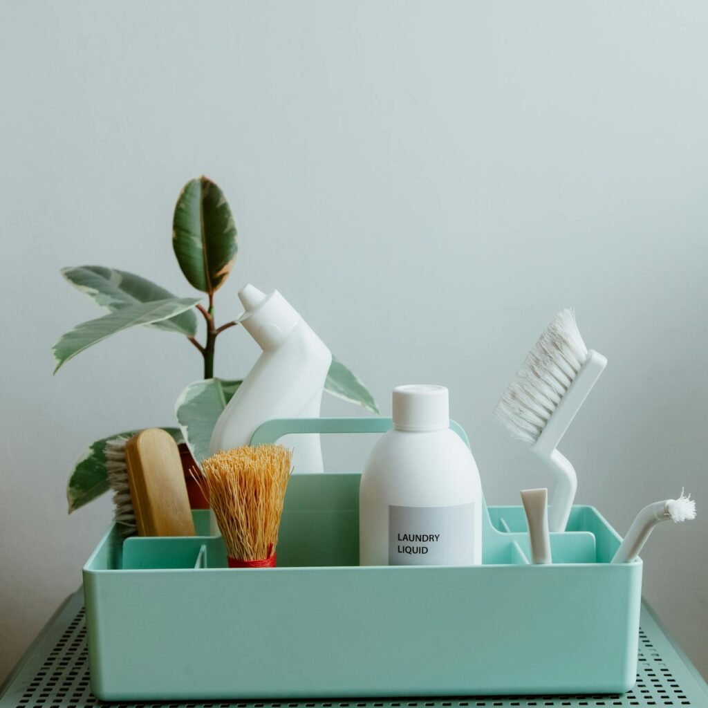 Minimalist display of eco-friendly cleaning products in pastel organizer, highlighting sustainable living.